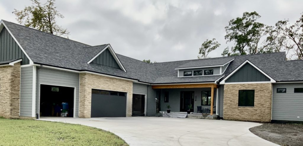 Grey and stone house with James Hardie Siding