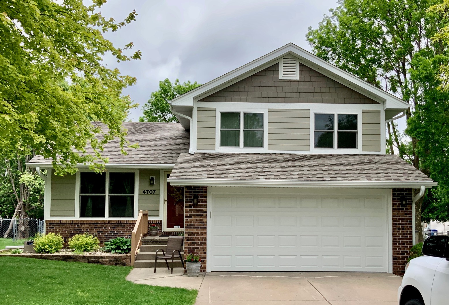 brown and cream house James Hardie siding