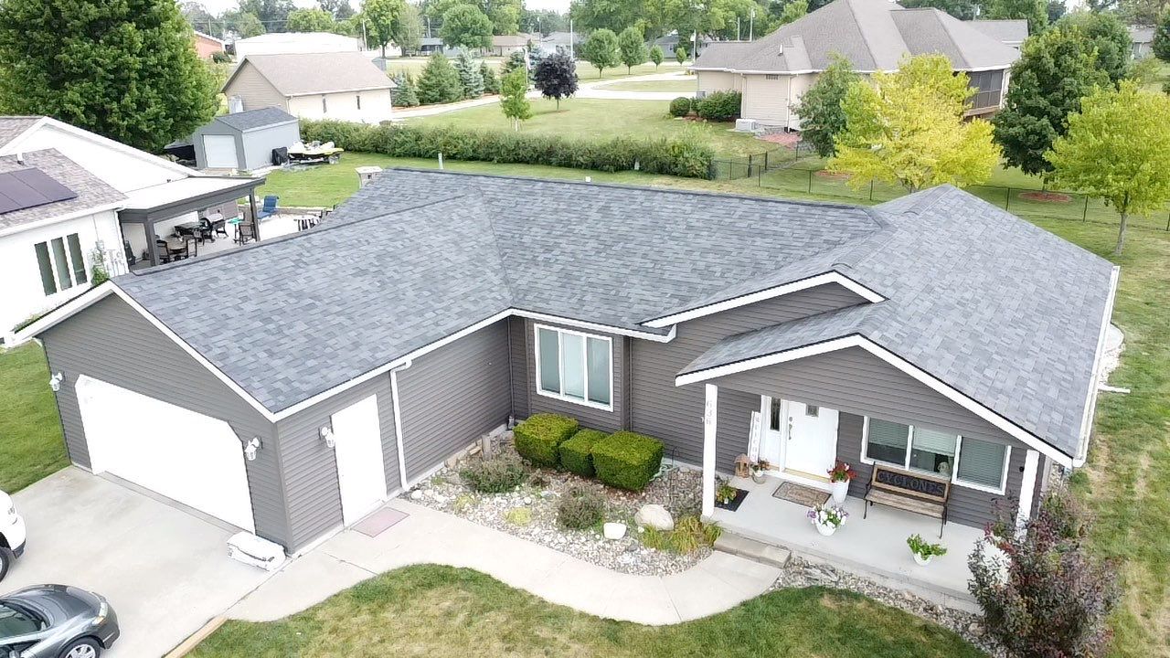 Grey house in bird eye view of roof