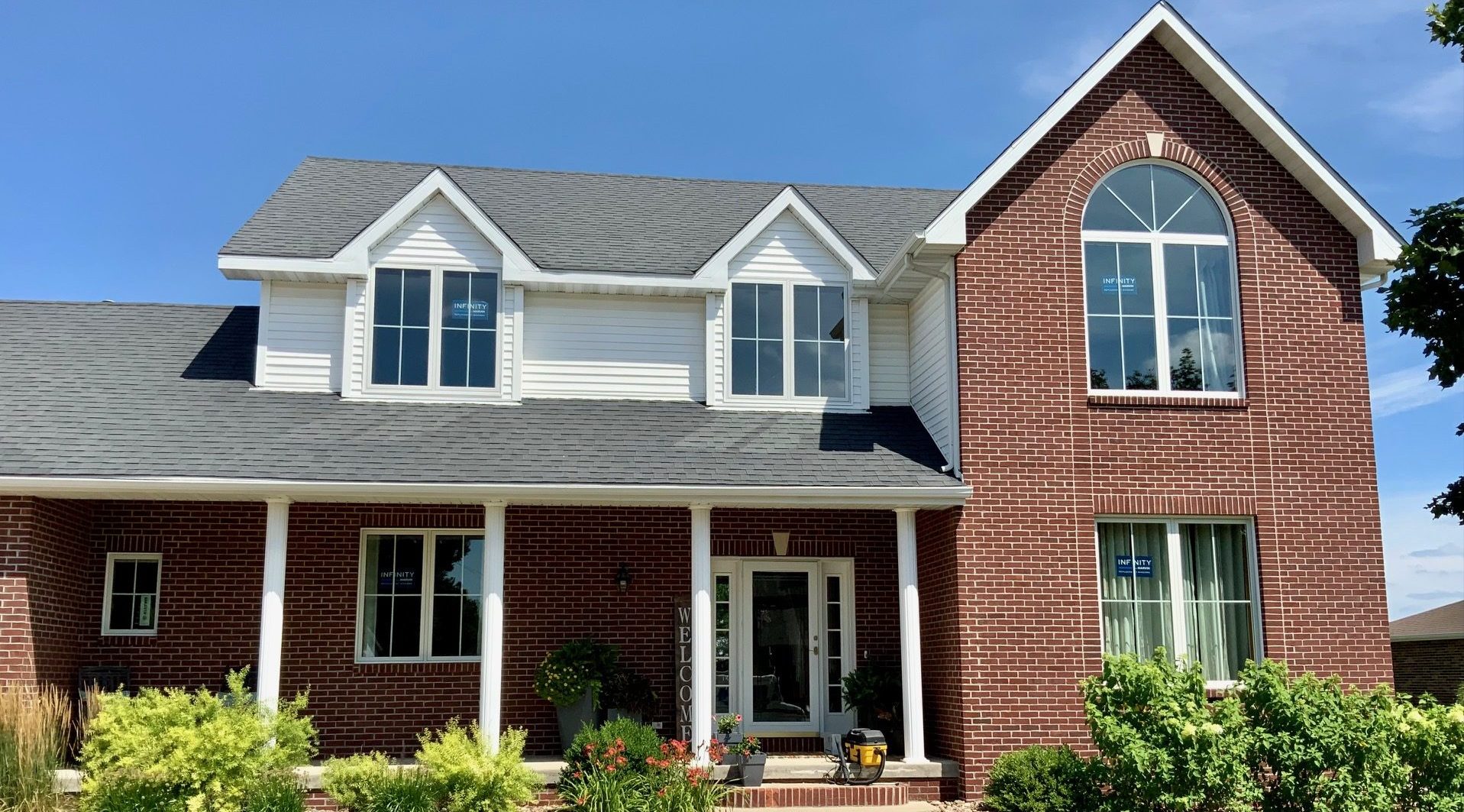 Front of house with new replacement windows